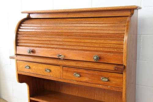 An incredible vintage solid oak roll top writing bureau with pull out writing top - very compact!
