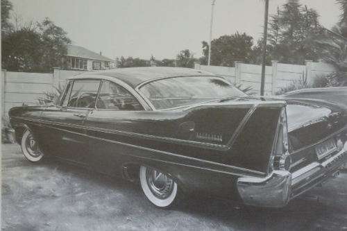 A signed limited edition print (no. 224/ 250) of a 1958 Plymouth Belve by Dean Scott Simon RS17