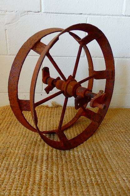 An awesome antique cast iron double-rimmed six-spoke Plough Wheel, perfect for any garden decor