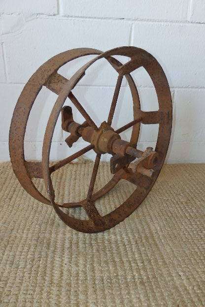 An awesome antique cast iron double-rimmed six-spoke Plough Wheel, perfect for any garden decor
