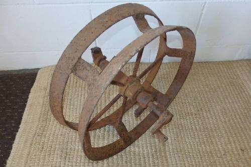 An awesome antique cast iron double-rimmed six-spoke Plough Wheel, perfect for any garden decor