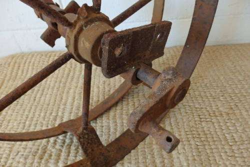 An awesome antique cast iron double-rimmed six-spoke Plough Wheel, perfect for any garden decor