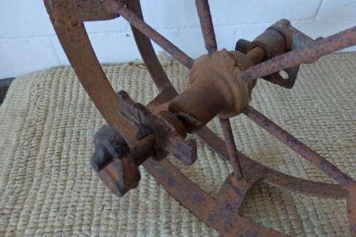 An awesome antique cast iron double-rimmed six-spoke Plough Wheel, perfect for any garden decor