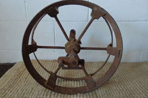An awesome antique cast iron double-rimmed six-spoke Plough Wheel, perfect for any garden decor