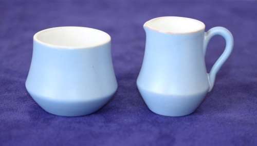 A gorgeous "Tea-For-Two" terracotta stoneware milk jug/ creamer and sugar bowl set in a soft blue