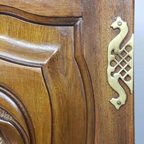 A stunning carved double-door solid Imbuia wardrobe with solid brass embellishments & ample space