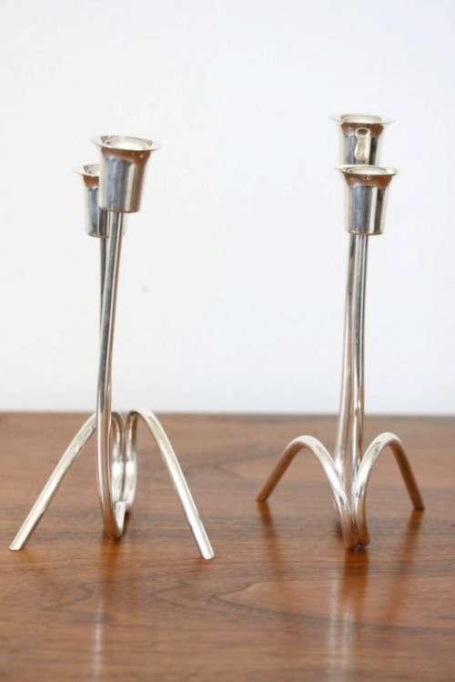 Two beautiful "modern" styled silver plated candle holders with an elegant design - bid/holder