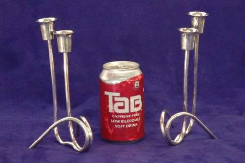 Two beautiful "modern" styled silver plated candle holders with an elegant design - bid/holder