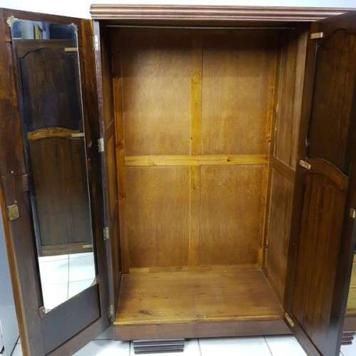 A spectacular Art Deco three-door solid Imbuia wardrobe with 8x drawers and loads of hanging space