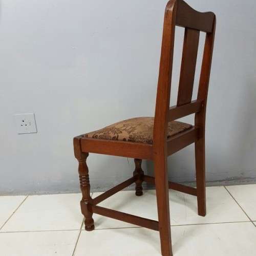 A beautiful and newly upholstered antique Edwardian occasional chair with beautiful turned legs