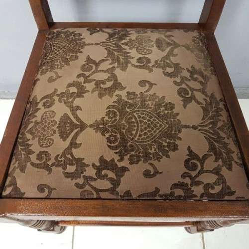 A beautiful and newly upholstered antique Edwardian occasional chair with beautiful turned legs