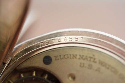 A spectacular Victorian antique (1914) "Elgin" gold plated pocket watch in perfect working condtion