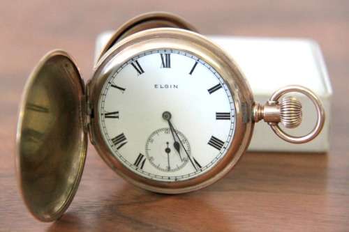 A spectacular Victorian antique (1914) "Elgin" gold plated pocket watch in perfect working condtion