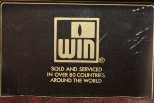 A superb original "Win Battery Electric" cigarette lighter with pouch in its original case