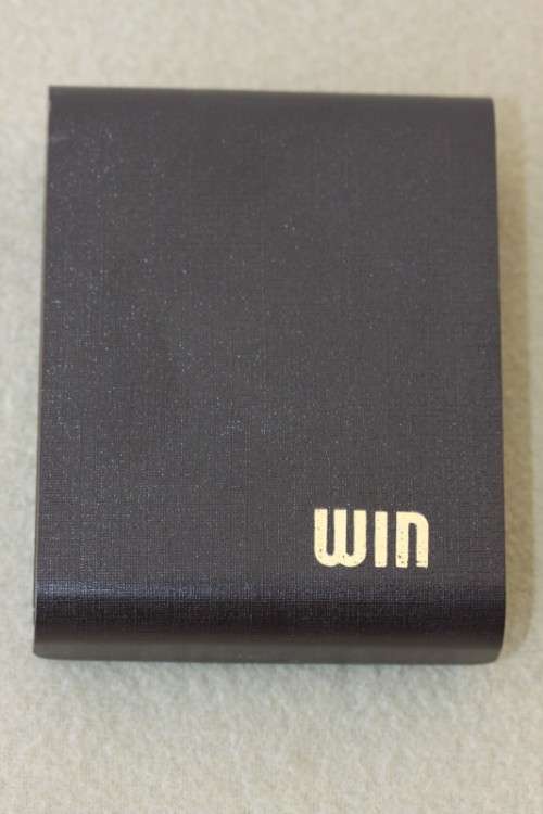 A superb original "Win Battery Electric" cigarette lighter with pouch in its original case