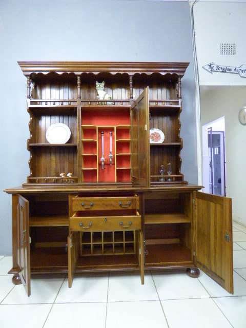 A magnificent walnut buffet cabinet w/ optics and 15 bottle wine rack. Magnificent quality!!!