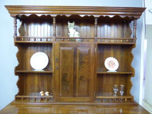 A magnificent walnut buffet cabinet w/ optics and 15 bottle wine rack. Magnificent quality!!!