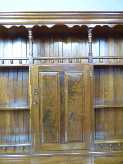 A magnificent walnut buffet cabinet w/ optics and 15 bottle wine rack. Magnificent quality!!!