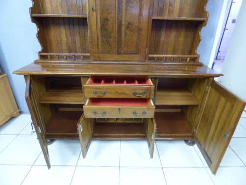 A magnificent walnut buffet cabinet w/ optics and 15 bottle wine rack. Magnificent quality!!!