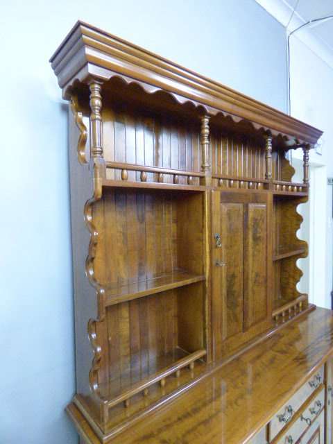 A magnificent walnut buffet cabinet w/ optics and 15 bottle wine rack. Magnificent quality!!!