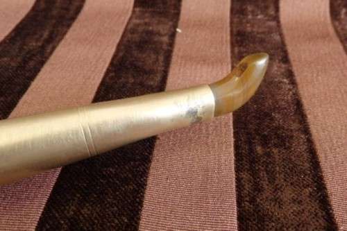 An incredible set of four vintage sculpting tools with wooden handles, brass cuffs & celluloid tips