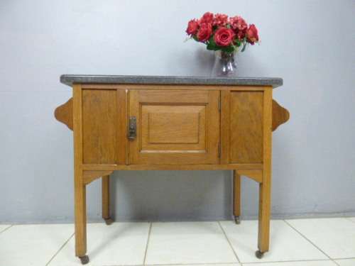A spectacular vintage Oak wash stand with a solid black marble top & spacious cupboard on castors