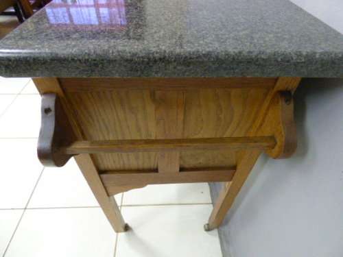 A spectacular vintage Oak wash stand with a solid black marble top & spacious cupboard on castors