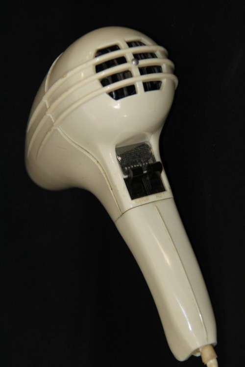 An exquisite vintage (1955) General Electric hair dryer w/ box & stand in perfect working condition