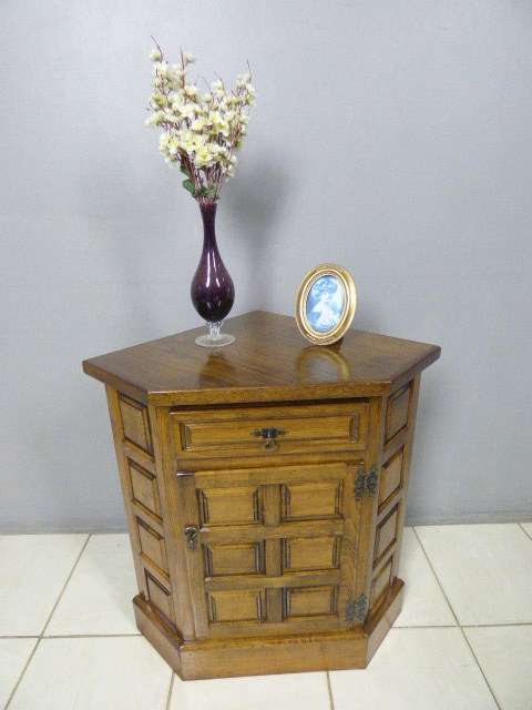 An exquisite vintage solid oak corner display cabinet with a large cupboard. Stunning in any home!!