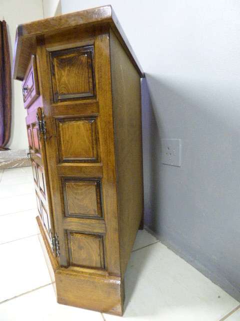 An exquisite vintage solid oak corner display cabinet with a large cupboard. Stunning in any home!!