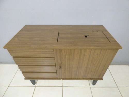 A lovely sewing cabinet with four drawers and a large cupboard. Perfect in a sewing/hobby room! RS17