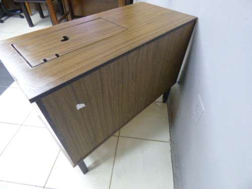 A lovely sewing cabinet with four drawers and a large cupboard. Perfect in a sewing/hobby room! RS17