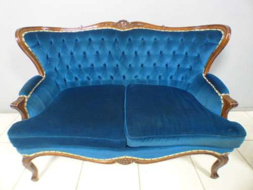 magnificent hand carved Victorian sofa's with deep button detailing and padded armrest.