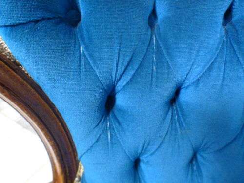 magnificent hand carved Victorian sofa's with deep button detailing and padded armrest.