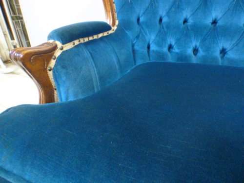 magnificent hand carved Victorian sofa's with deep button detailing and padded armrest.