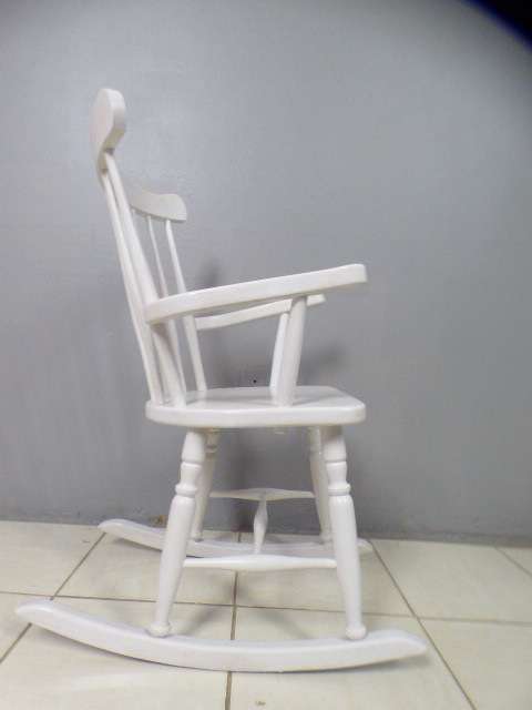 An exquisite white painted rocking chair - gorgeous in a baby room or on a patio!!!