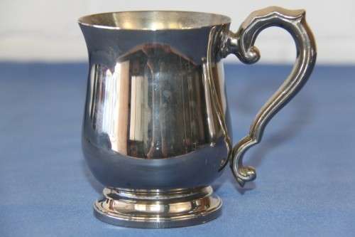 An awesome pair of silver plated mugs with ornate handles in stunning condition