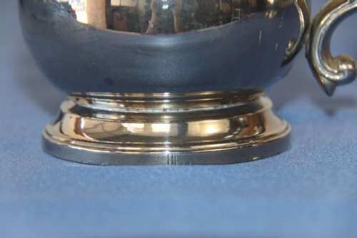 An awesome pair of silver plated mugs with ornate handles in stunning condition