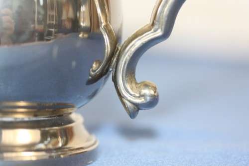 An awesome pair of silver plated mugs with ornate handles in stunning condition