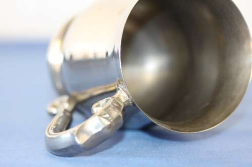 An awesome pair of silver plated mugs with ornate handles in stunning condition