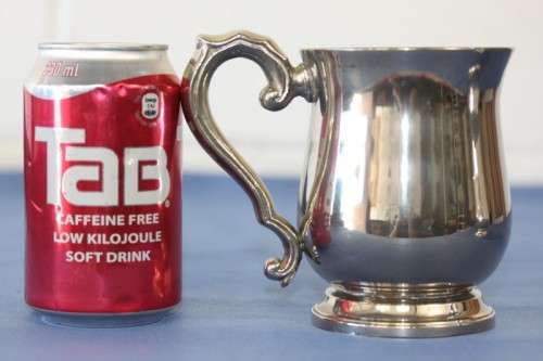 An awesome pair of silver plated mugs with ornate handles in stunning condition