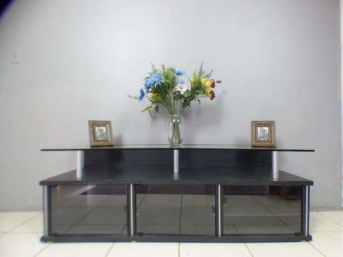 A stunning stylish TV stand with place for your entertainment centre and a thick glass top RS17