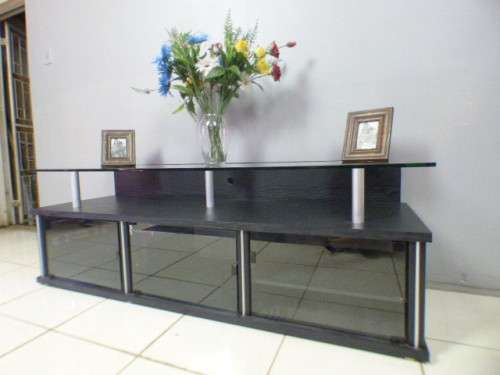 A stunning stylish TV stand with place for your entertainment centre and a thick glass top RS17