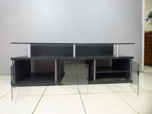 A stunning stylish TV stand with place for your entertainment centre and a thick glass top RS17