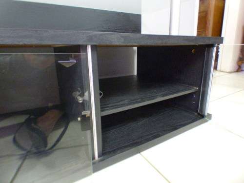 A stunning stylish TV stand with place for your entertainment centre and a thick glass top RS17