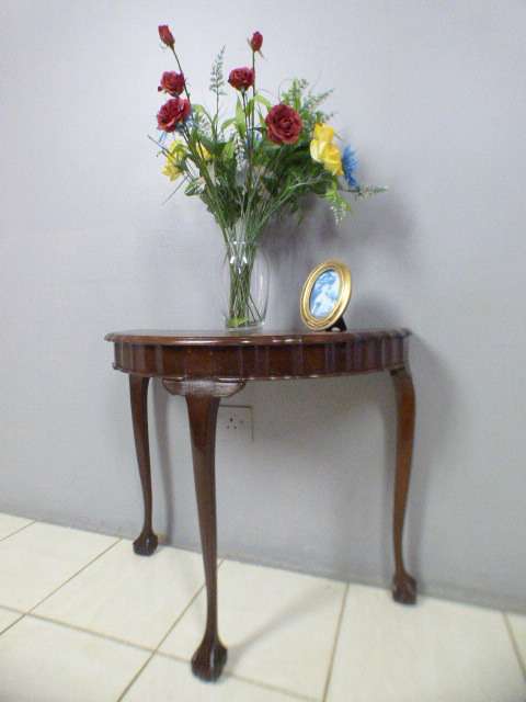 A beautiful vintage ball & claw Imbuia half moon display/occasional table. Gorgeous in an entrance!!