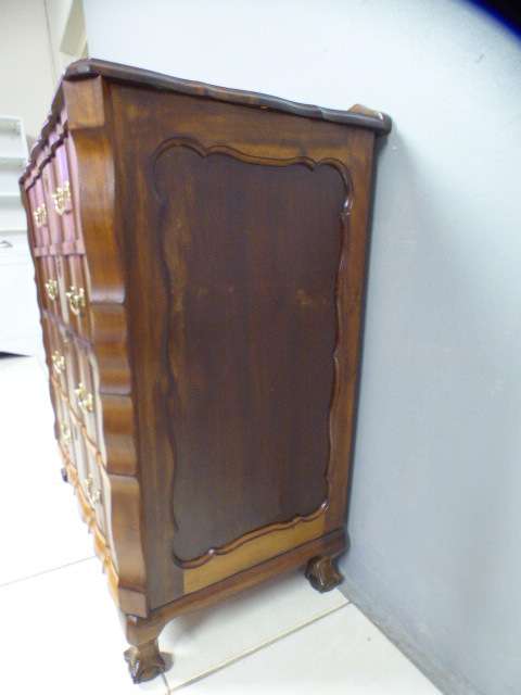 An exquisite vintage Imbuia 4-drawer chest of drawers with ornate handles and ample storage space