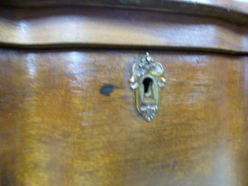 An exquisite vintage Imbuia 4-drawer chest of drawers with ornate handles and ample storage space