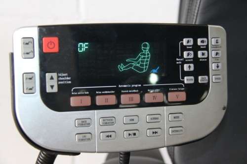 An incredible large automatic massage chair with electronic keypad and headphones