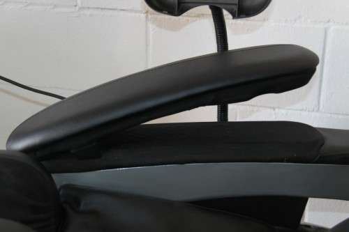 An incredible large automatic massage chair with electronic keypad and headphones